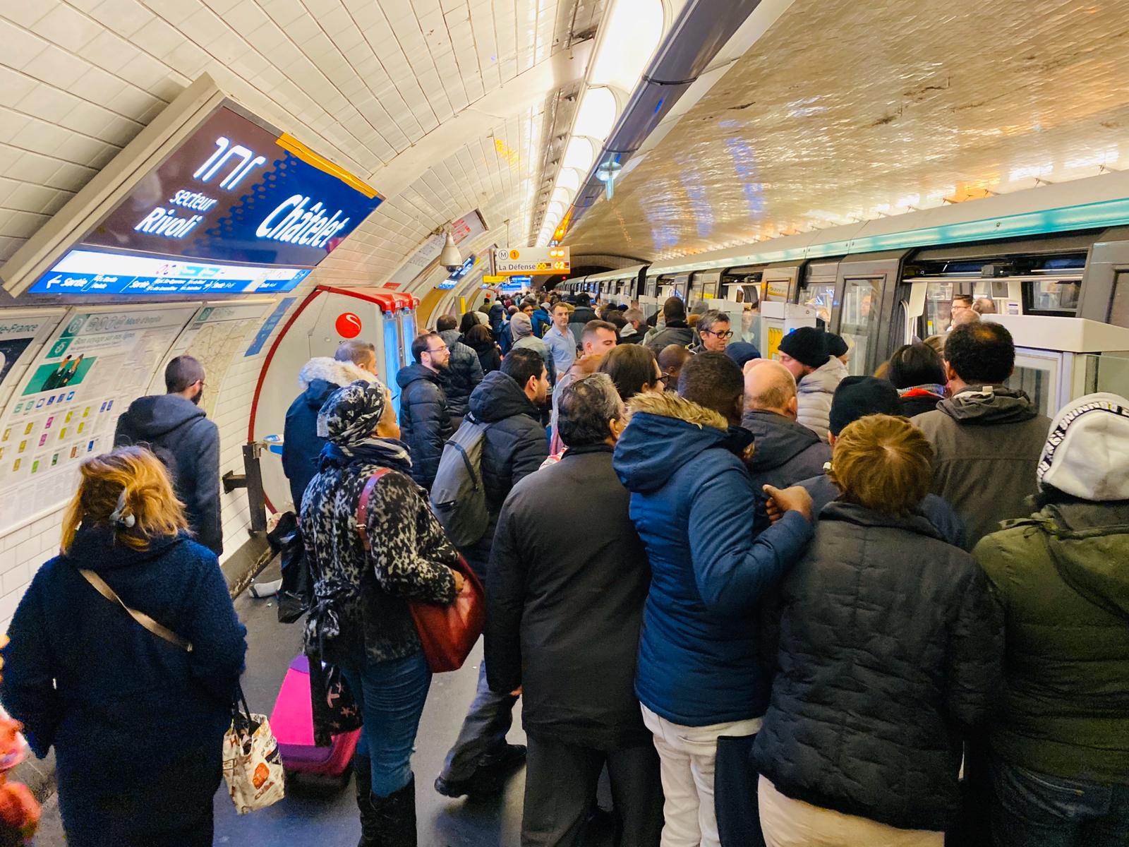 Busy Paris Metro line 1 platform during 2020 train strikes