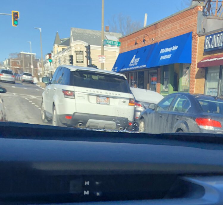 TheSaltMonster's tweet photo. @BostonPWD @universalhub @CityOfBoston It’s great when they clean off the bike lanes. Makes it way easier to double park.  This guy in the white Land Rover agrees. https://t.co/8Zyst8x4d9