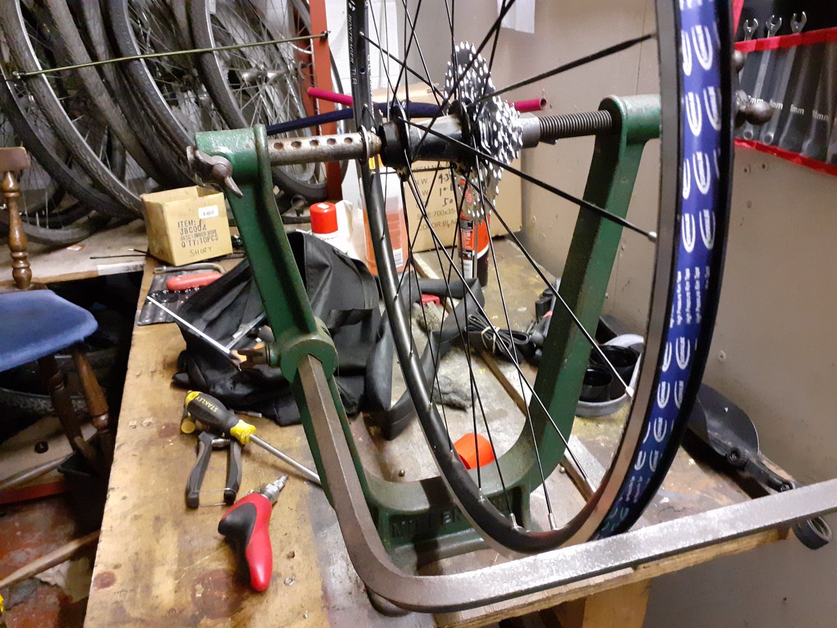2wheeledworld's tweet photo. Been on the tools again at Life Recycle using a good old solid truing stand from the 80s what do you think @guypartleton #bikemechanic #mechanic #volunteering #volunteers https://t.co/s90Aczyov6