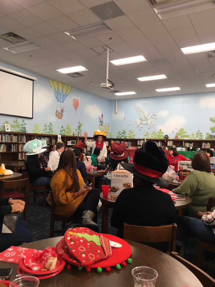 lhwhite74's tweet photo. Holiday hats and food @OKE_HCS. We had lots of fun during our white elephant party. https://t.co/kk37bEofP8