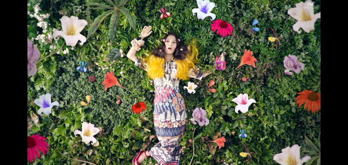 11. However, this is scene is almost a premonition on what will happen to Seulgi in the future. Lying in the ground, with flowers all over the place. Indicating she will d*e.