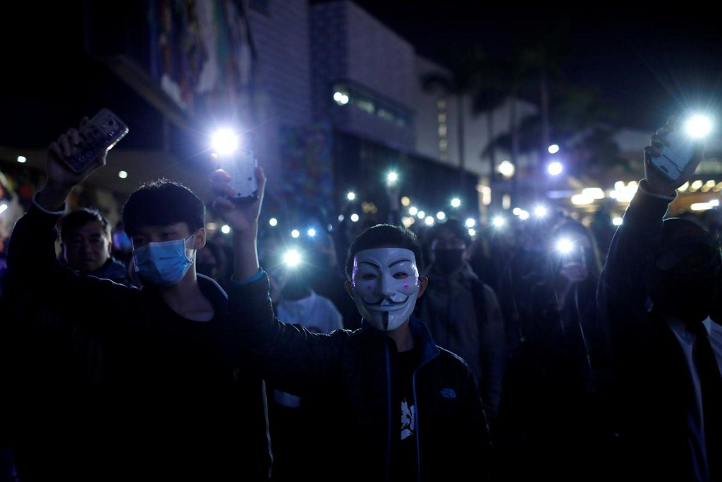 Reuters's tweet photo. Hong Kong protesters march to consulates to call for support on rights https://t.co/5Wn5ZQMBTq https://t.co/Lpi38kbpib