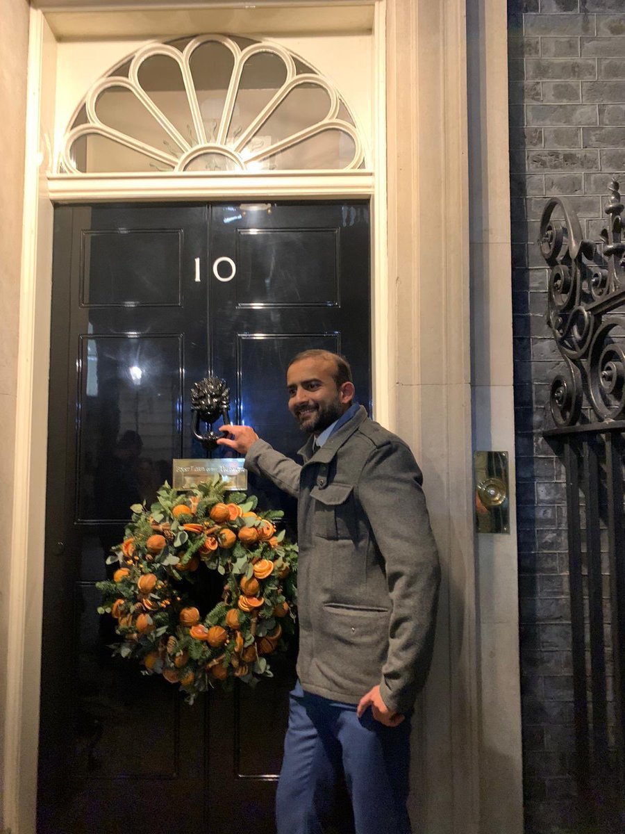 ImperialNHS's tweet photo. We’re very proud that our own Winny Thomas, Rangaprakash Muthukumarasamy and Dr Anne Kinderlerer were invited to a special reception for frontline NHS staff at 10 Downing Street last night. Don’t they look great in front of that famous door? https://t.co/zHhtgBbyA9