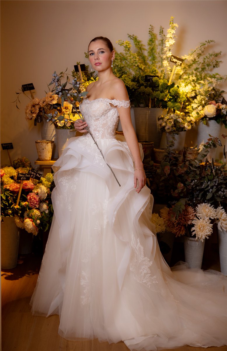 #Newdesigns Meadow C136 
This show stopping gown Meadow is a fresh modern look! 
She is embellished with botanical lace appliqué expertly cascading down from the sheer off-shoulder bodice to her  sculpted tulle train. Back finished with sparkling crystal buttons.

#weddingdress