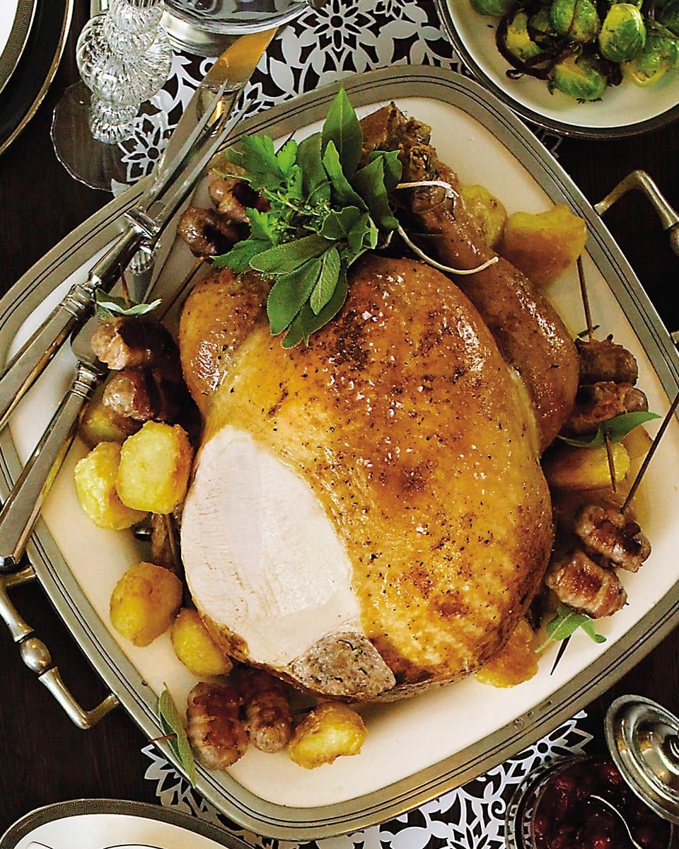 Searching for the best turkey recipe? This is it. A golden roast turkey is stuffed with date, pancetta and sausagemeat stuffing and served on a platter of chipolata pigs in blankets. #christmasdinner #turkey #deliciousfood  buff.ly/2P2Tubu