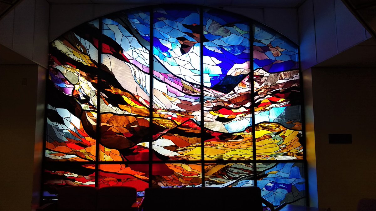 UCFadmissions's tweet photo. There are tons of fantastic sights to behold when walking outdoors on the #UCF campus, but did you know that UCF has breathtaking views indoors as well? This gorgeous stained glass window makes for a pretty incredible study spot in the UCF Library! #ExploreUCF https://t.co/vPquI5Dnfx