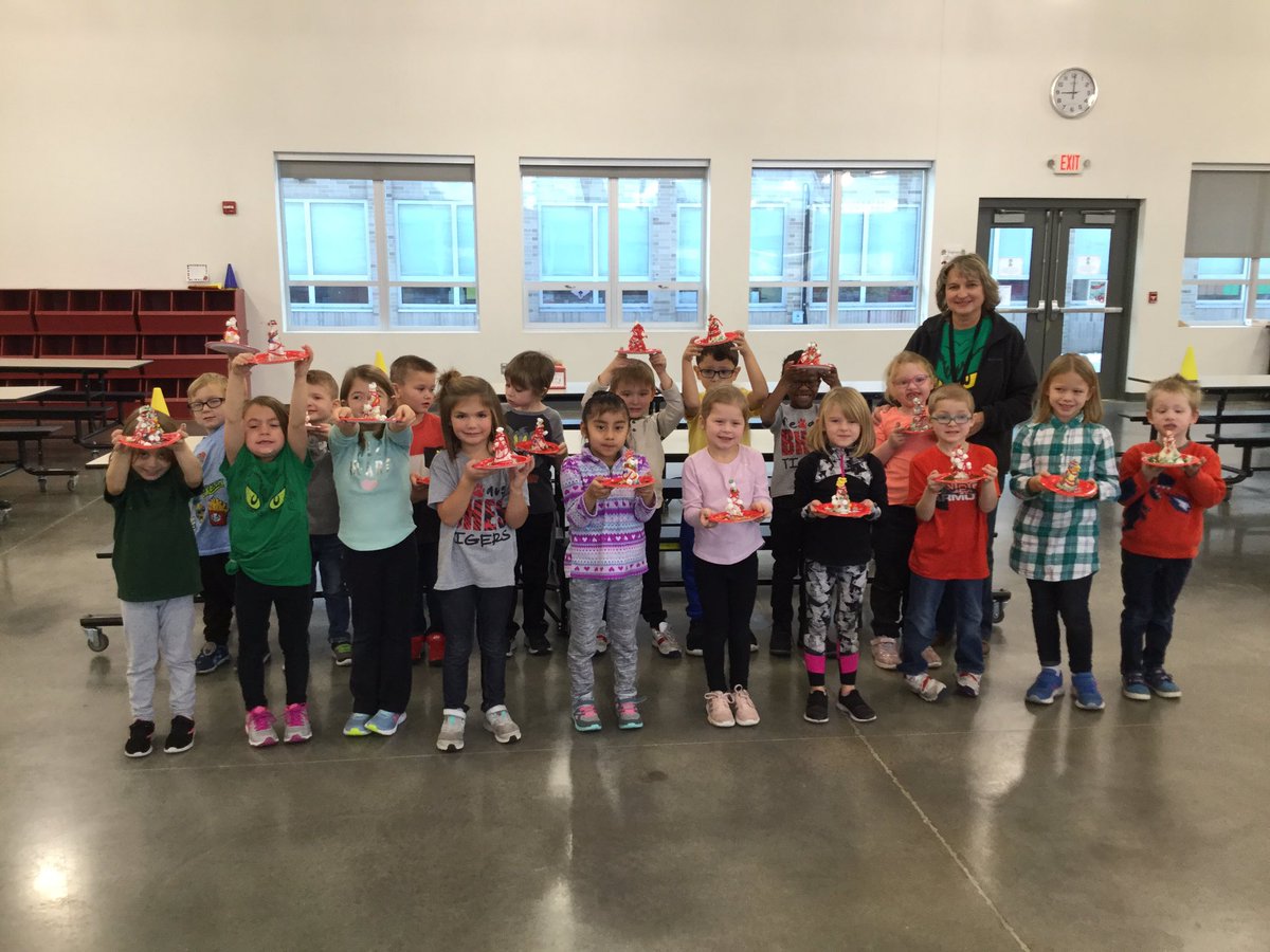 joyce_jevans's tweet photo. Such a great time in Kindergarten.  Decorating Christmas trees on “Grinch Day”! https://t.co/PxDHCOYAnR