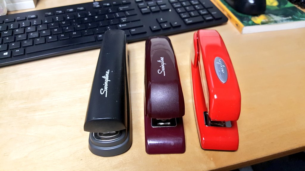 yadrick's tweet photo. My @swingline stapler fleet. New red one gift from my coworkers who are tired of me borrowing theirs. https://t.co/MVf3RgyLSV
