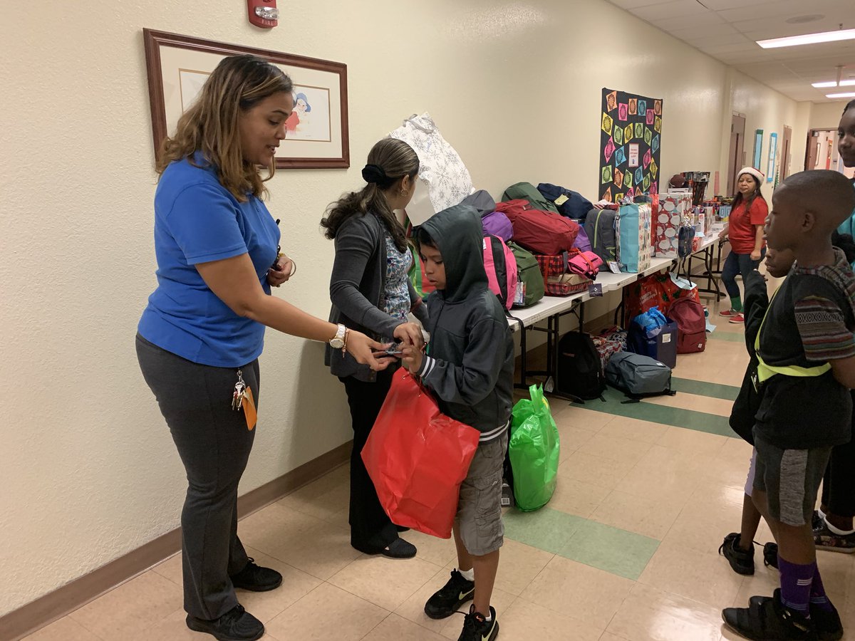 TheomaneD's tweet photo. The staff of Barton as they spread the joy of the holiday season with every child. @BartonChargers @nancyreesefl @hainesv @pbcsd https://t.co/aA6Mu9ttpb