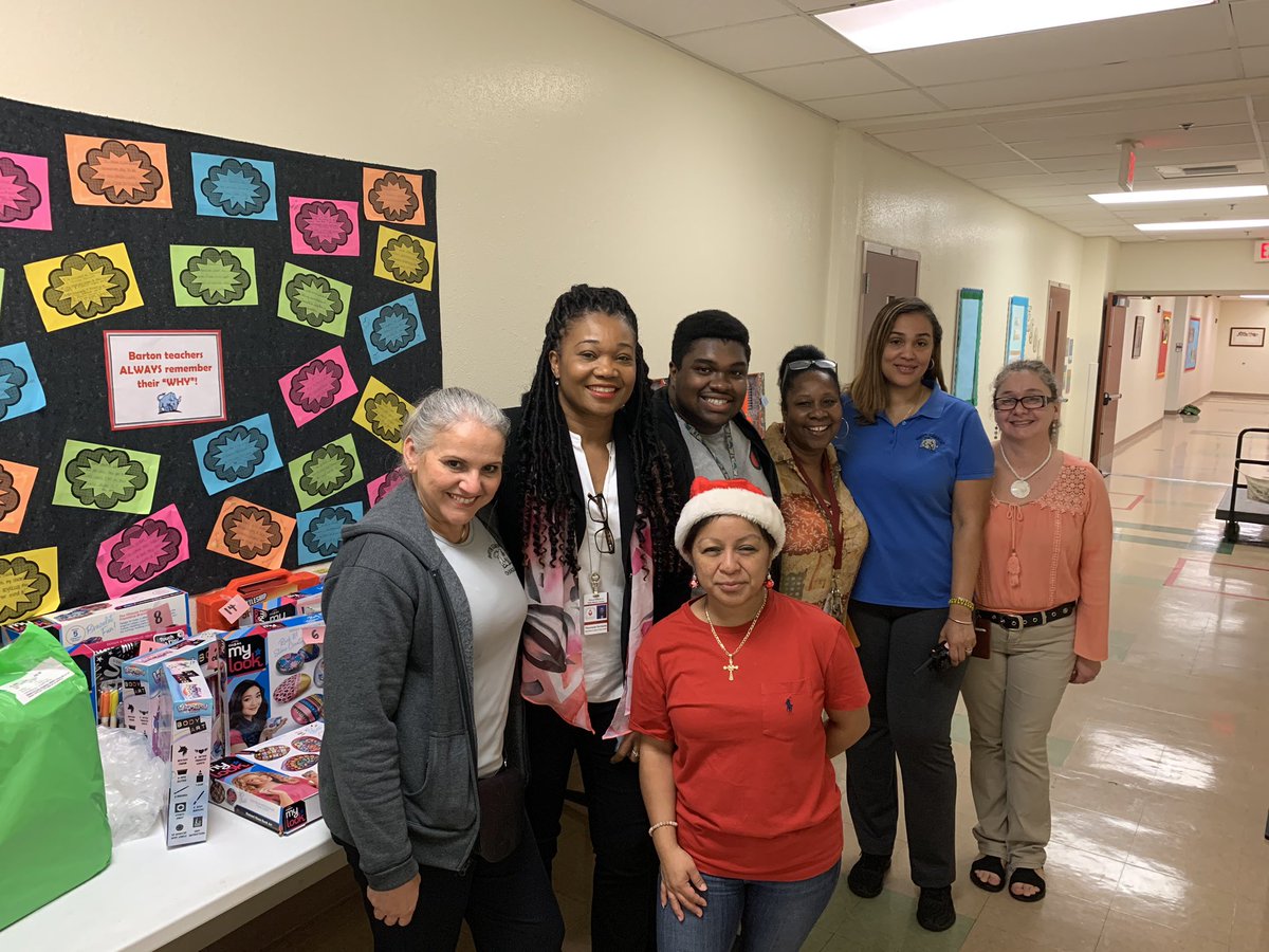 TheomaneD's tweet photo. The staff of Barton as they spread the joy of the holiday season with every child. @BartonChargers @nancyreesefl @hainesv @pbcsd https://t.co/aA6Mu9ttpb