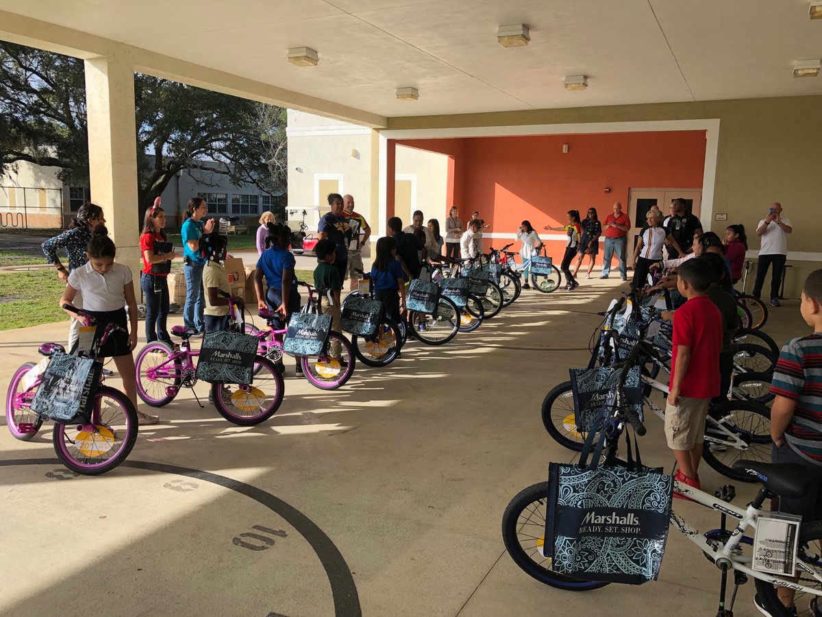 BocaPolice's tweet photo. Another year, another amazing giveaway by the @BocaBikeClub! This week, @BocaPolice teamed up with the club and @marshalls to surprise some outstanding elementary school students with new bikes and helmets. It was a heartwarming day to say the least! https://t.co/RIjsaK2TjG