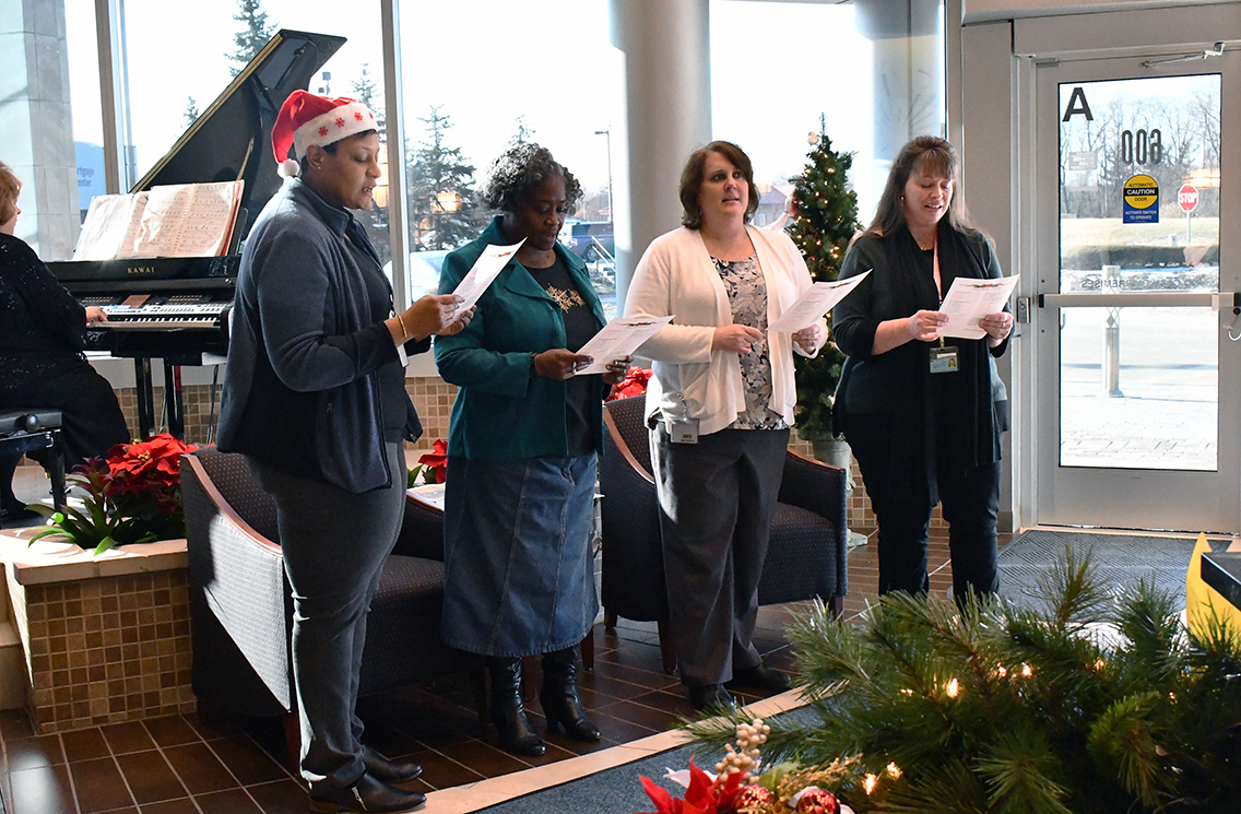CentierBank's tweet photo. Associates gathered in the lobby at our Centier Centre to sing Christmas Carols today! What's your favorite holiday song? #FunAtCentier #Centier #FeelingFestive #HolidaySpirit https://t.co/WscSrxv9Cq