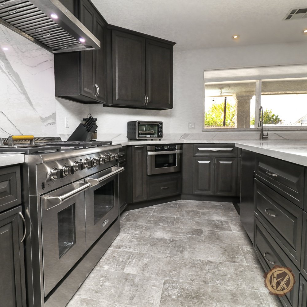 Our client used Stonedale during his remodel to give his kitchen a timeless look - combining white granite with our dark, smokey cabinets. For fans of darker kitchens, Stonedale is our line of solid maple, smokey bronze transitional kitchen cabinets. #kitchedesign #kitchenremodel