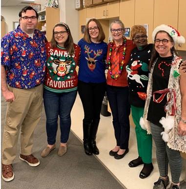 BocaLibrary's tweet photo. We're looking good in our #UglyChristmasSweater at the Downtown and Spanish River #BocaLibrary! https://t.co/MnGsPXEnl9