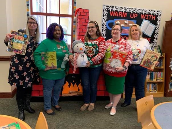BocaLibrary's tweet photo. We're looking good in our #UglyChristmasSweater at the Downtown and Spanish River #BocaLibrary! https://t.co/MnGsPXEnl9