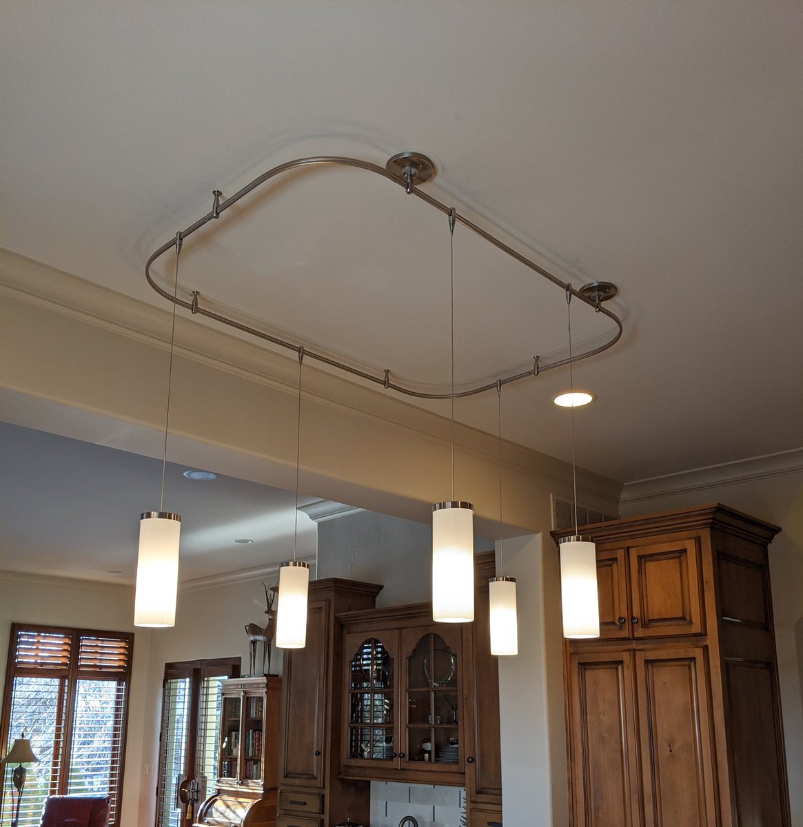 lukeborn's tweet photo. Went to hang a fixture and it showed using a pipe bender to make the corners but the customer wanted bigger corners so I decided to wrap the track around my fish tape instead.  I think it turned out pretty good. What say you? #electricianlife #fixtures #lights #lighting https://t.co/BYZjFzlq14