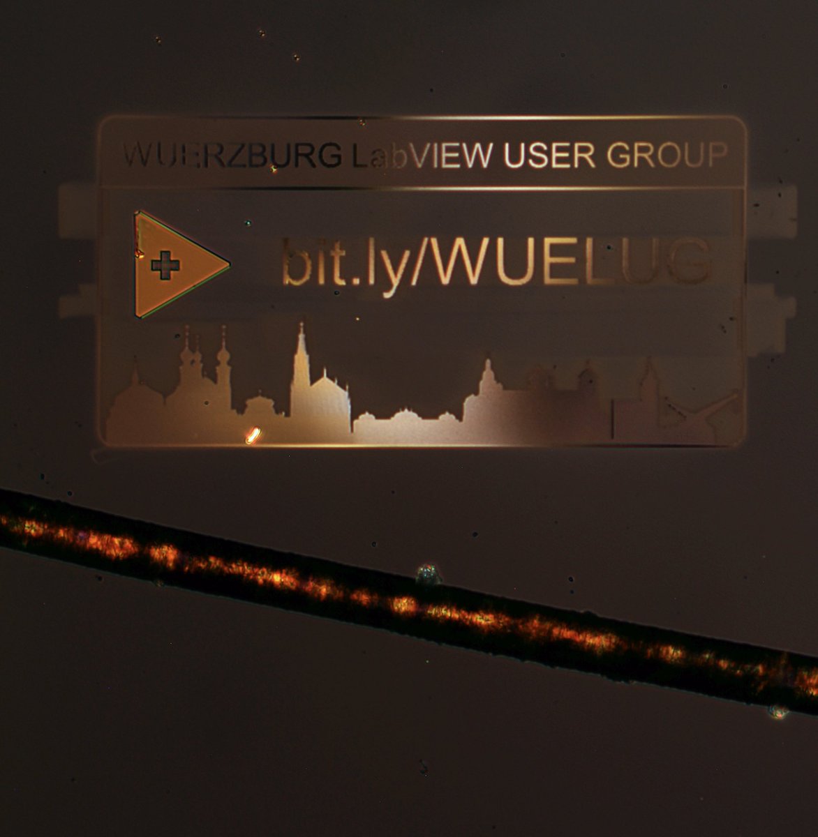 Ladies and gentlemen! The probably smallest #LabVIEW logo in the world, engraved into a gold layer with Gallium and Helium atoms! Behold the line below it: That‘s a human hair!!! #WUELUG #teamhampelsoft <a href="/NIglobal/">NI (now part of Emerson)</a> <a href="/labview/">LabVIEW</a>