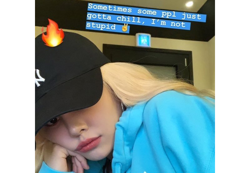 allkpop's tweet photo. CLC's Sorn is trending #1 worldwide on Twitter after posting a photo with a friend wearing a racist caricature mask and telling people to 'chill' https://t.co/vPWG9Y9xIP https://t.co/ytNgFwNr3O