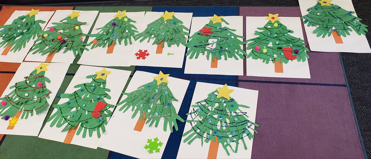 Christmas trees made from our hands to practice our cutting skills! #emcsd