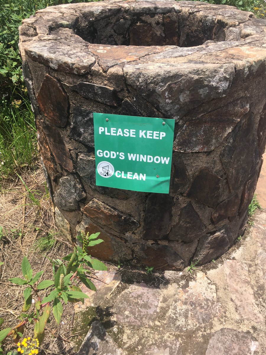 Sign “Please keep God’s Window clean”