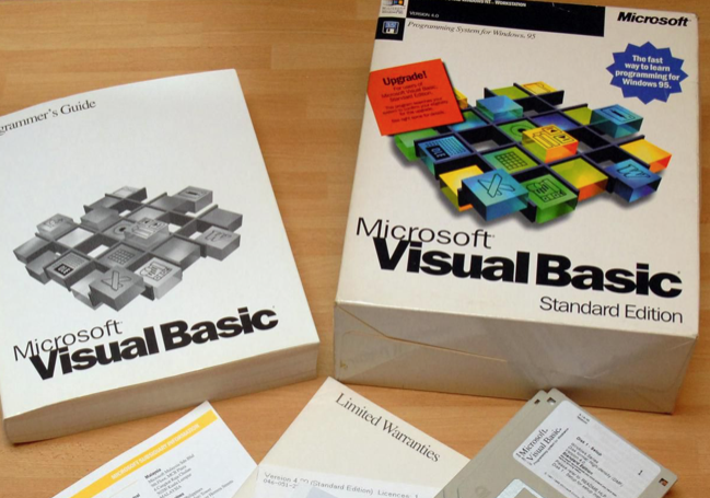 Photo of a CD case of Microsoft Visual Basic - Standard Edition being used.
