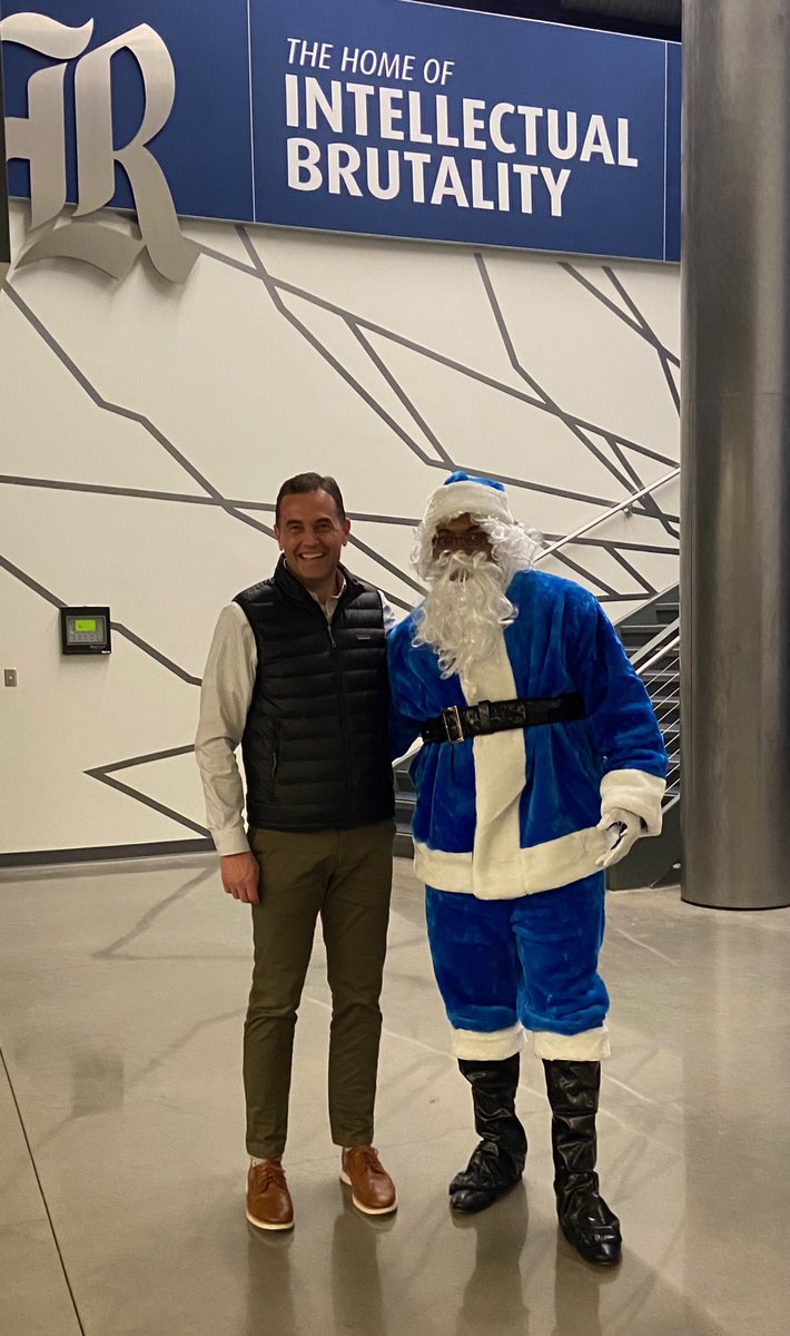 RiceCompliance's tweet photo. “Compliance” Claus stopped by the @RiceAthletics holiday party to let @jkarlgaard know that all of his coaches were all nice this year! 🦉👍#GoOwls #RFND https://t.co/IIgh0fj2gg