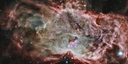 Gaseous swirls of red and orange with a cluster of stars in the middle