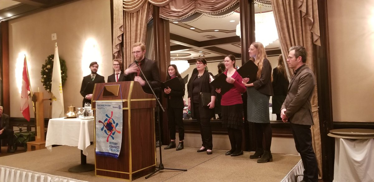 neillang's tweet photo. Talented Fr Mike pays xmas songs at Rotary  @yegrotary supported by the amazing Pro Coro choir.  Rotary connects! https://t.co/Fk4sSnb3fZ