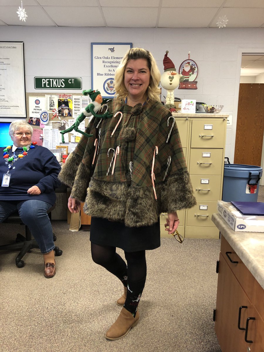 OaksOffice's tweet photo. It may be ugly sweater day but Mrs Canning can actually rock a tree skirt!! https://t.co/mBtK9bQXRJ