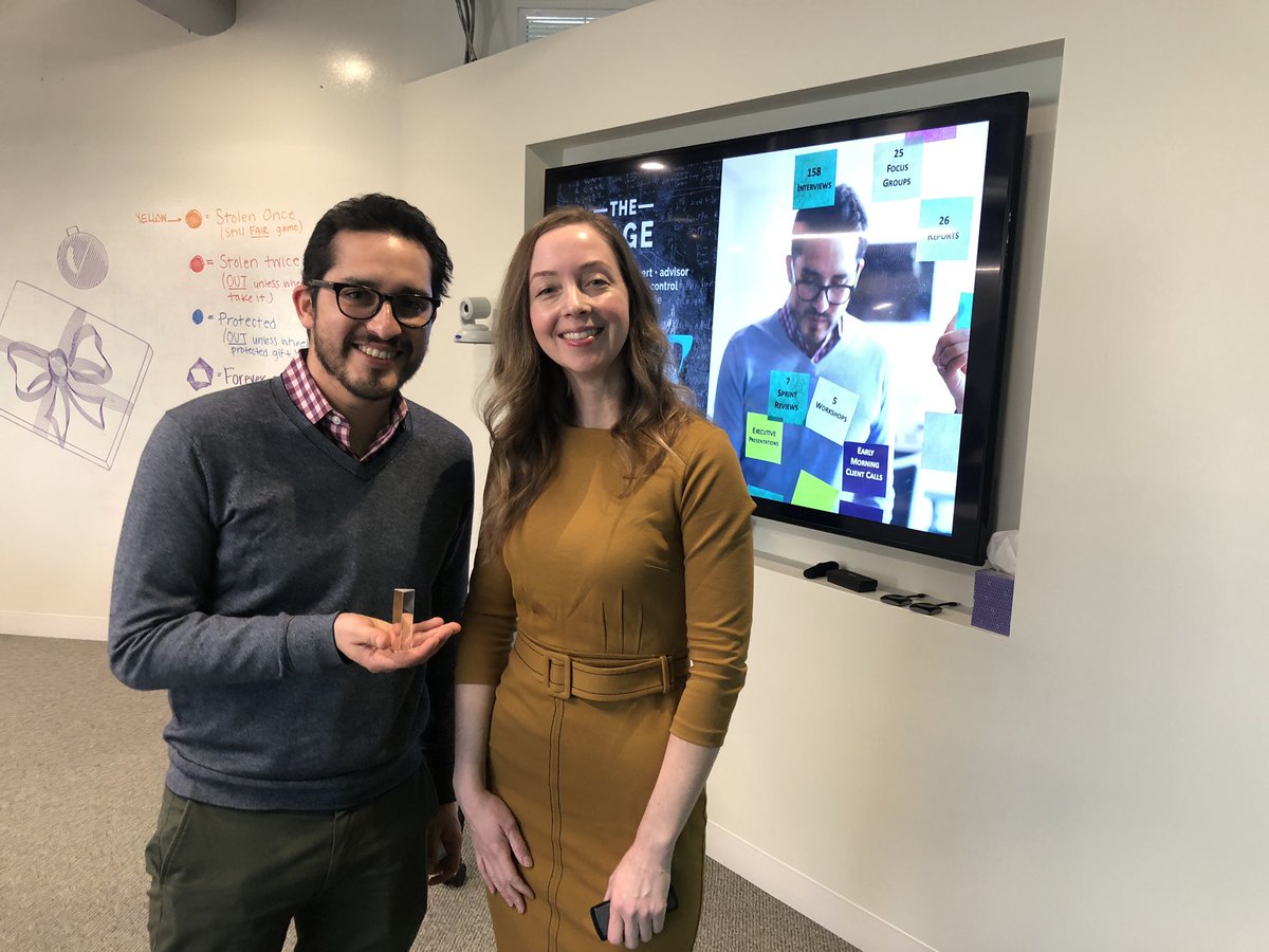 Guillermo receives his award from Kristin.  Posing with award.