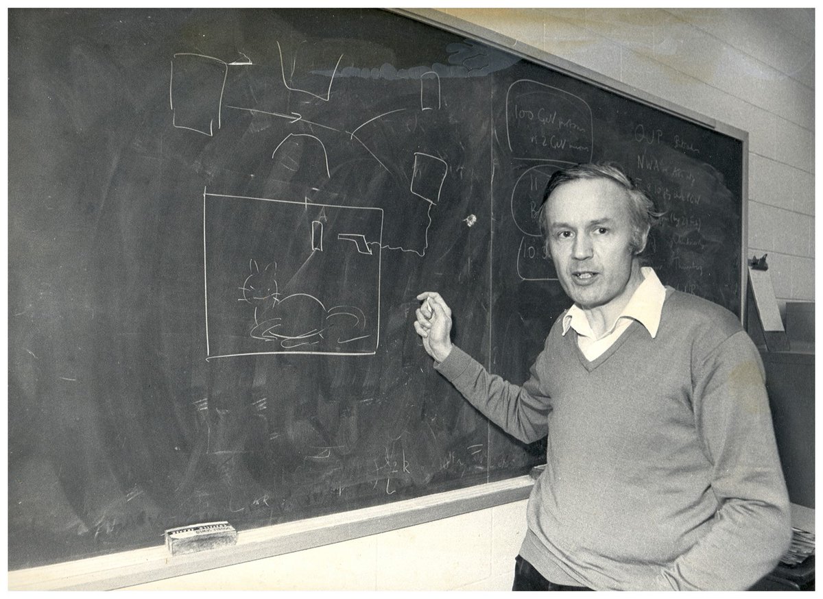Professor Leggett in front of his chalk drawing depicting Schrodinger's cat