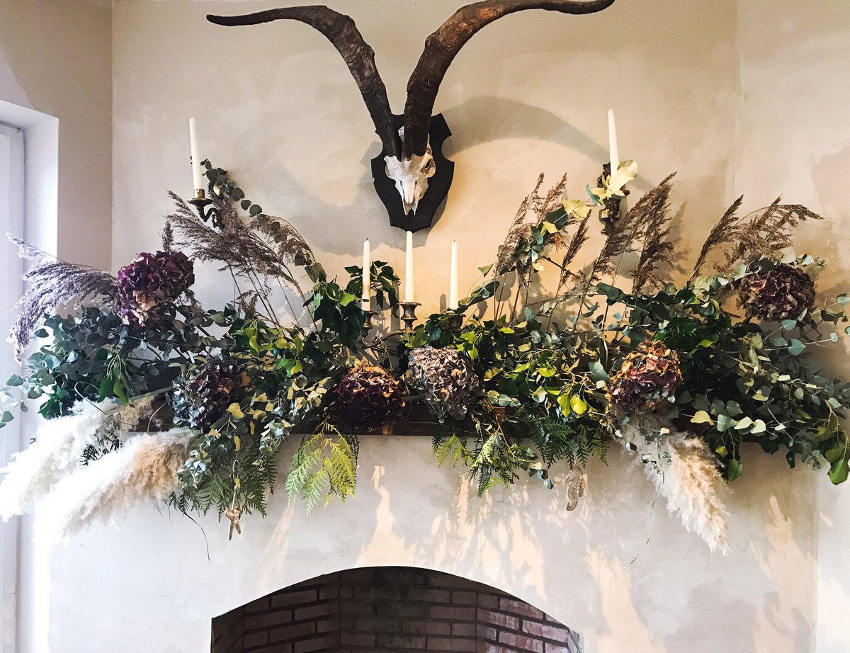 Haven't got round to getting a tree this year so I'm gonna stick with this. Foliage from garden, beach &amp; forest. Skull found on coast of Islay and gifted to Al when he paddleboarded from Giant's Causeway to Scotland. Won't be able to light the candles under the skull but sure 🙈