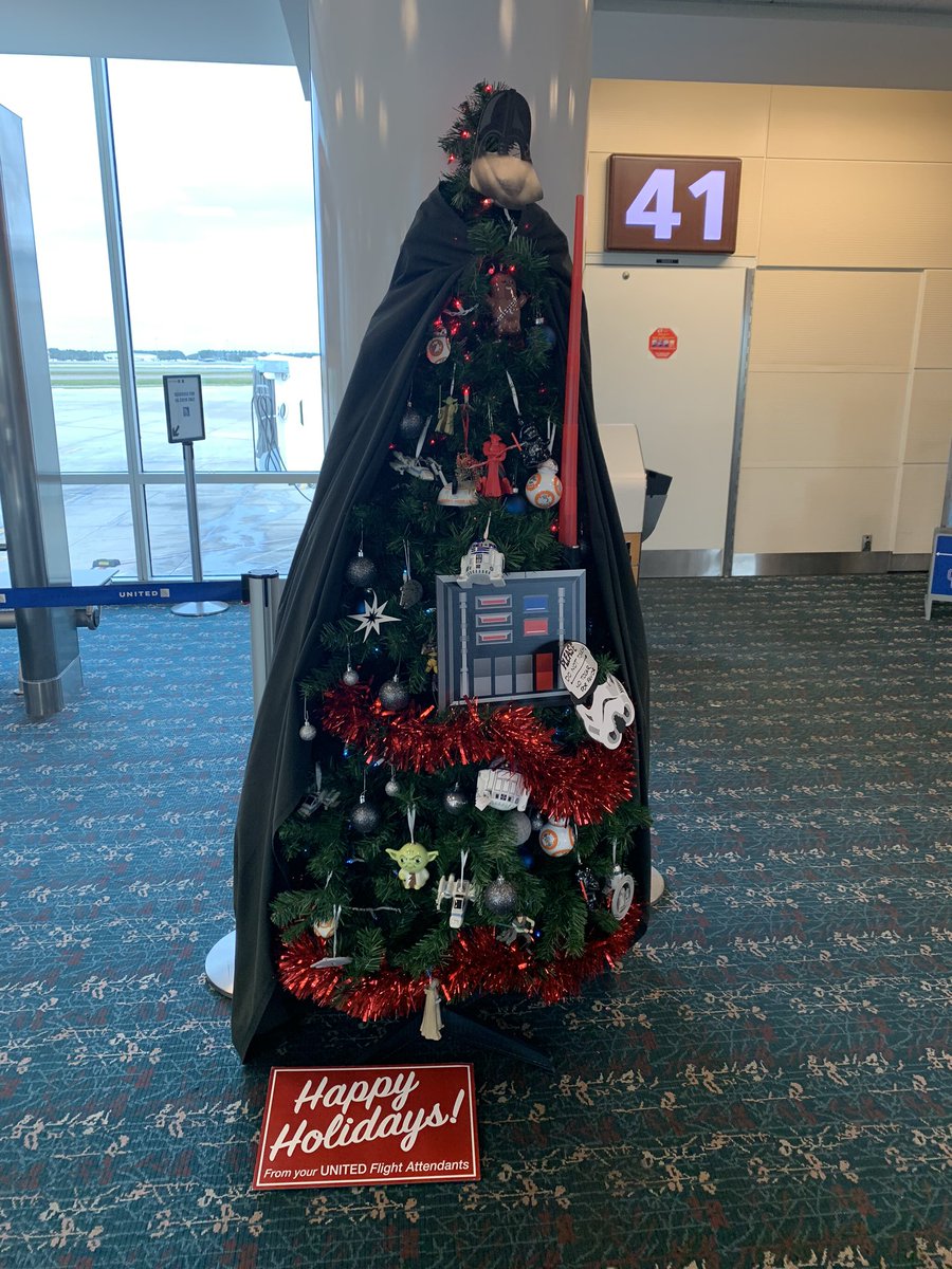 HigherOrbits's tweet photo. #MayTheForceBeWithYou during your travels this holiday season. Loving this @starwars tree at one of the @united gates at @MCO! Great space inspired #FestiveHolidayFun!! #SpaceInspires #HappyHolidays #DarthVader https://t.co/motH2geKzJ
