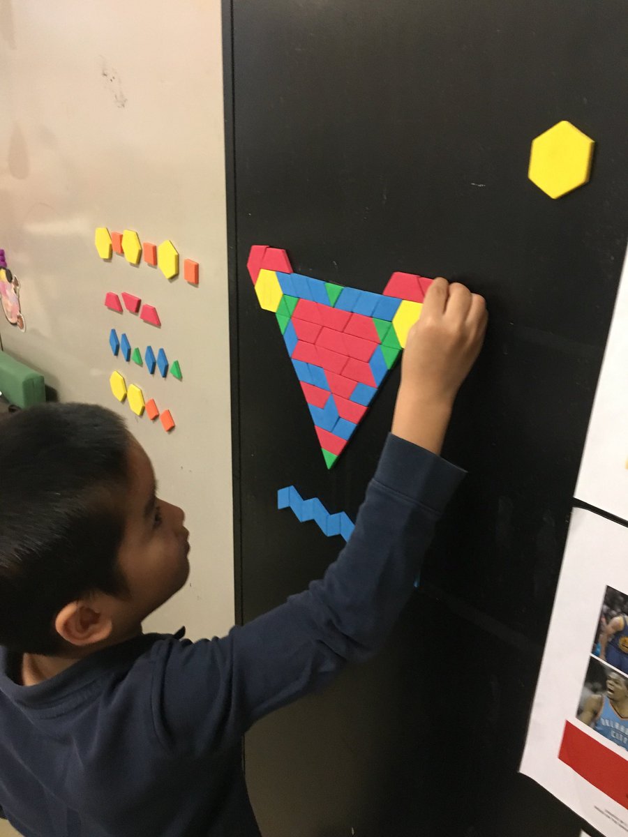MsGinaYu's tweet photo. One of the spaces the Gr. 2s and 3s like to go to in the classroom is the magnetic wall with shapes. I can almost find them making a different picture or configuration everyday! #whatcanyoumake #settingupthethirdteacher https://t.co/OrqOo3Vv55