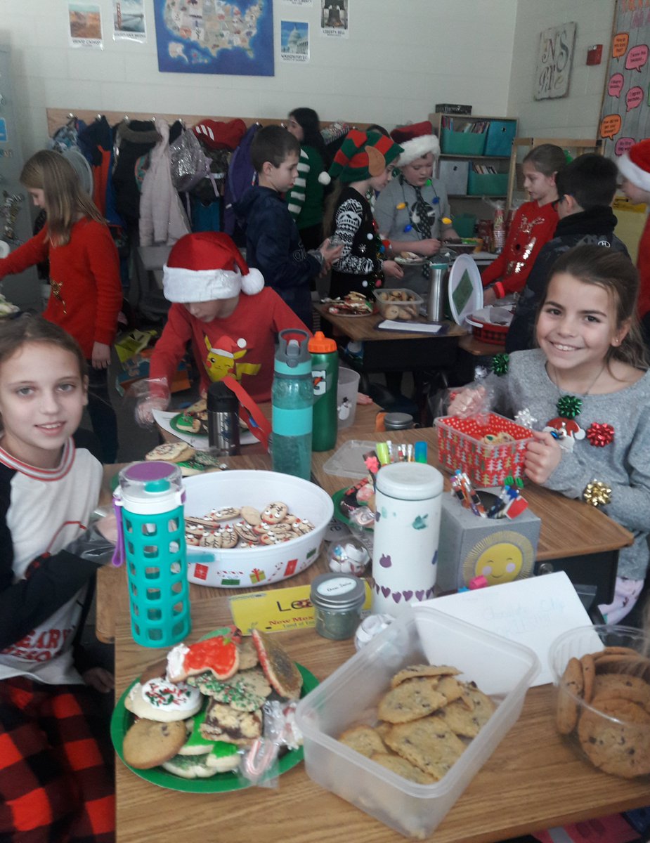NS_Grade4's tweet photo. Oh what fun with a #holidaycookie swap on #UglySweaterDay https://t.co/Bq2WJ6swvR