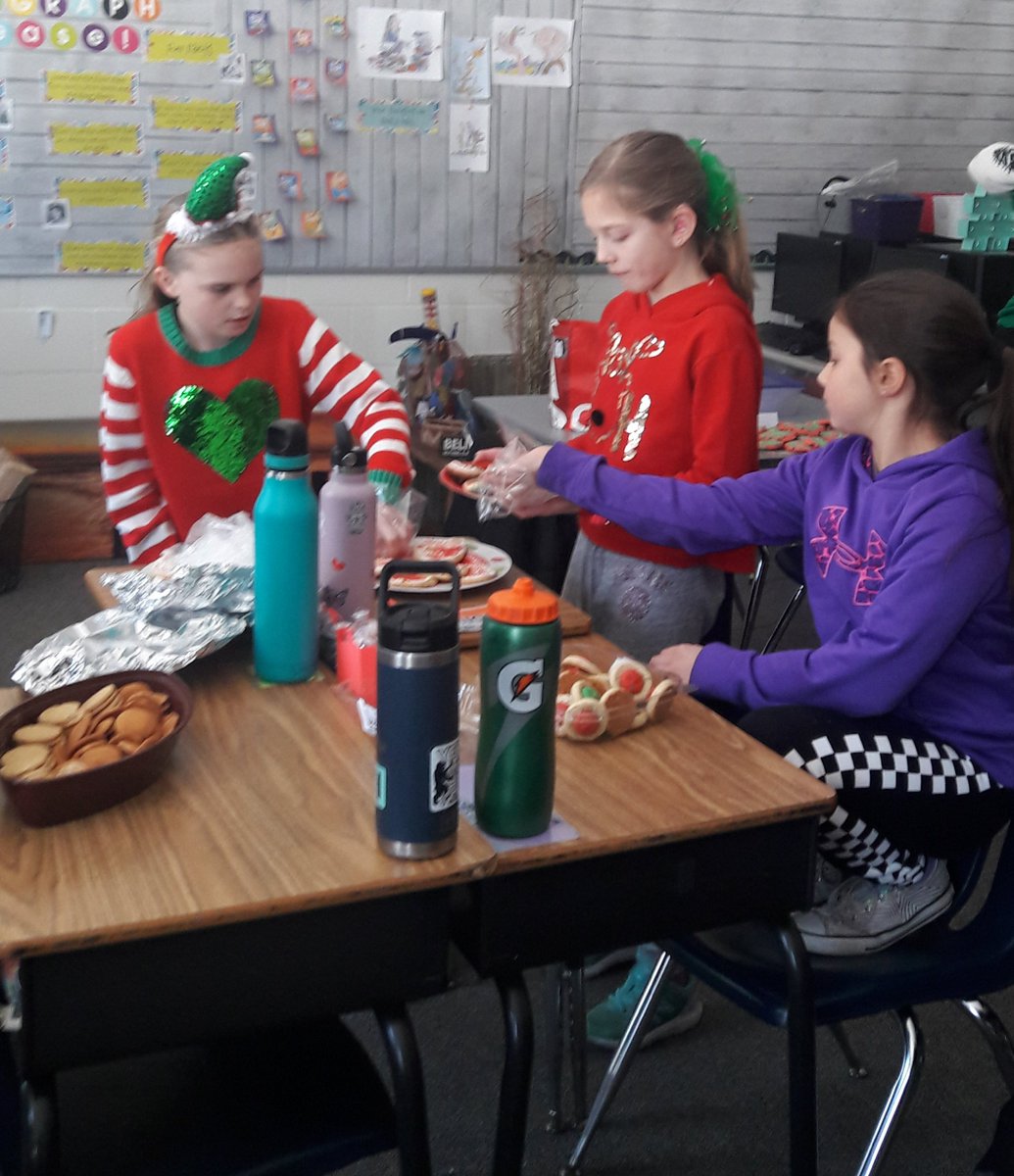 NS_Grade4's tweet photo. Oh what fun with a #holidaycookie swap on #UglySweaterDay https://t.co/Bq2WJ6swvR