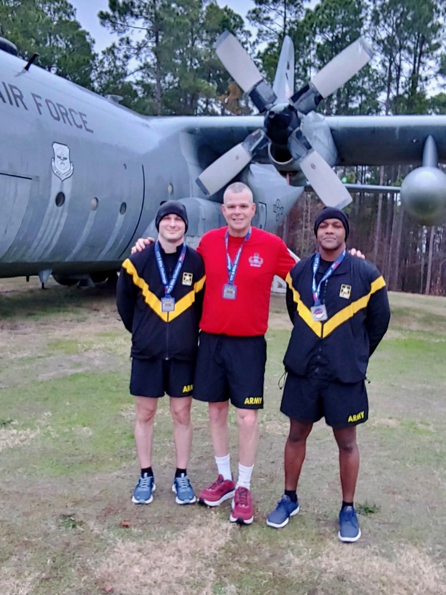 agcra's tweet photo. Pic 1 - LTC Randy Lefebvre (center) presented MAJ Mike Hanna & CW2 Bernard Simmons with their AGCRA 177.5 Mile Challenge Medal in front of the C-130 Hercules at Ft Bragg, NC on 13 Dec 2019. Pic 2 - LTC Lefebvre was also awarded his medal. @IAgcra #AGCRA #AGCorps #42A #AGATW https://t.co/fwYDEIit0C