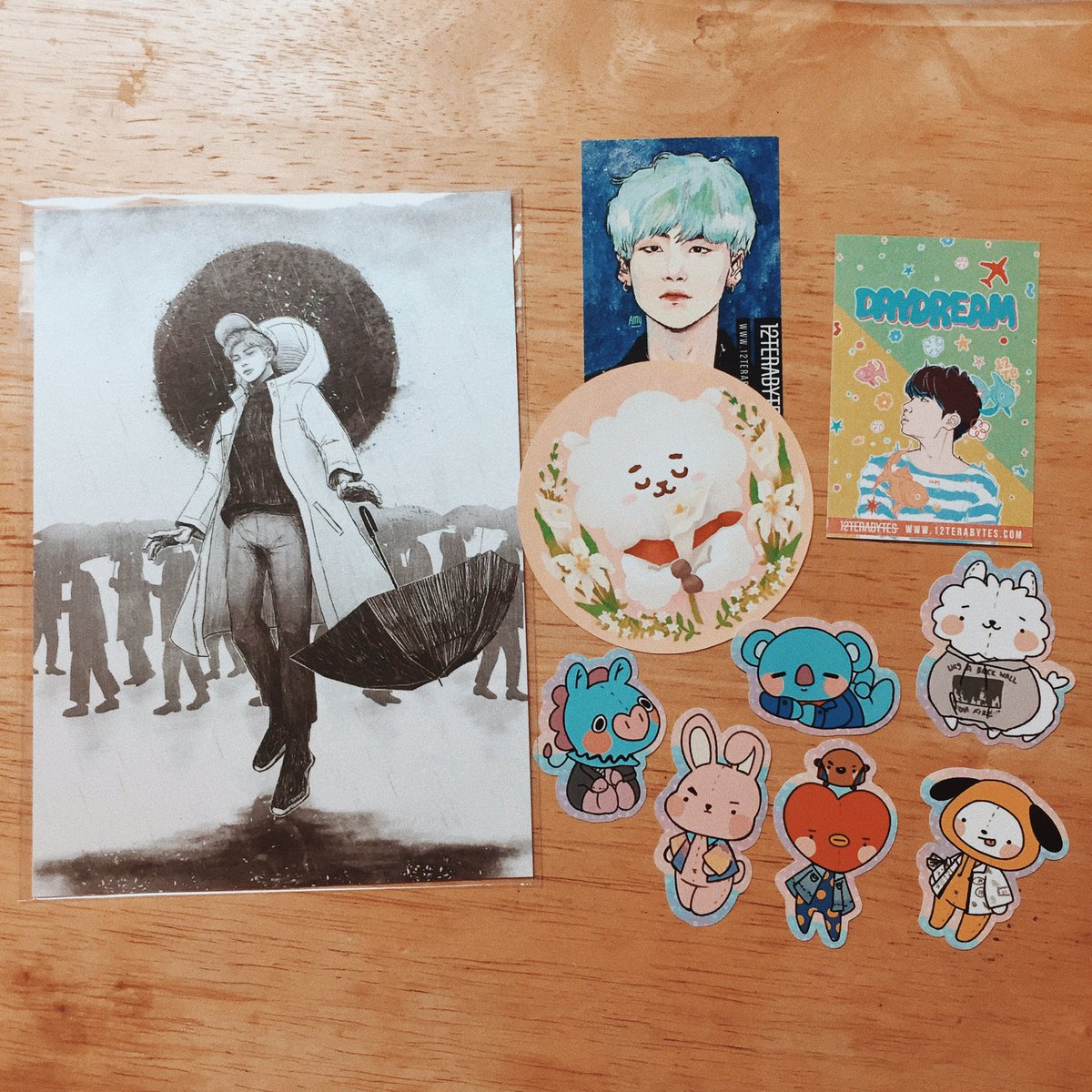 idreamofyoongi's tweet photo. super cute prints and stickers from @12Terabytes i regret not getting that moonchild hat ๐ญ #RayOfLightKSJ https://t.co/5vEFTwrdXC