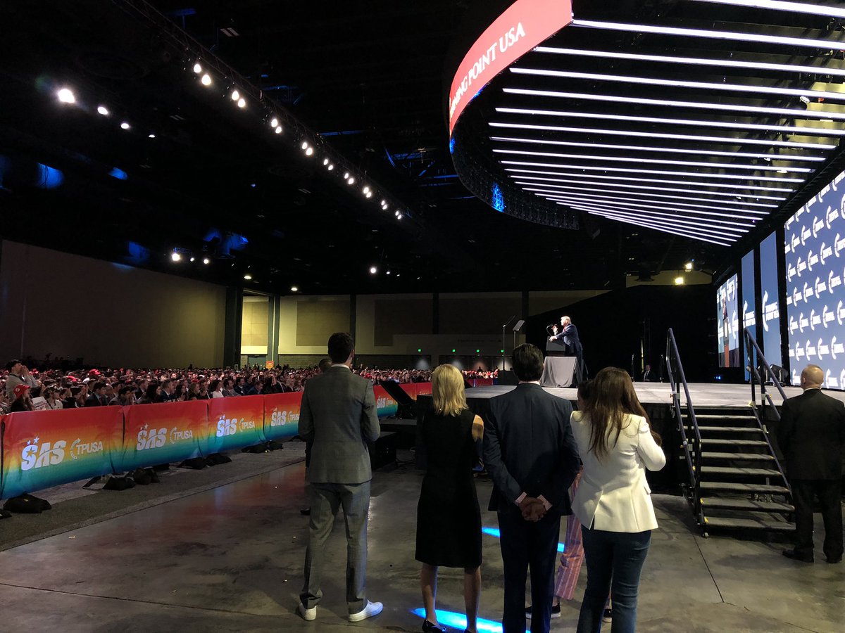 DonaldJTrumpJr's tweet photo. Proud to stand with dad at @tpusa! 3000+ motivated conservatives all cheering for border security, more conservative judges, less government and MAKING AMERICA GREAT AGAIN! https://t.co/RbX1dPQDE3