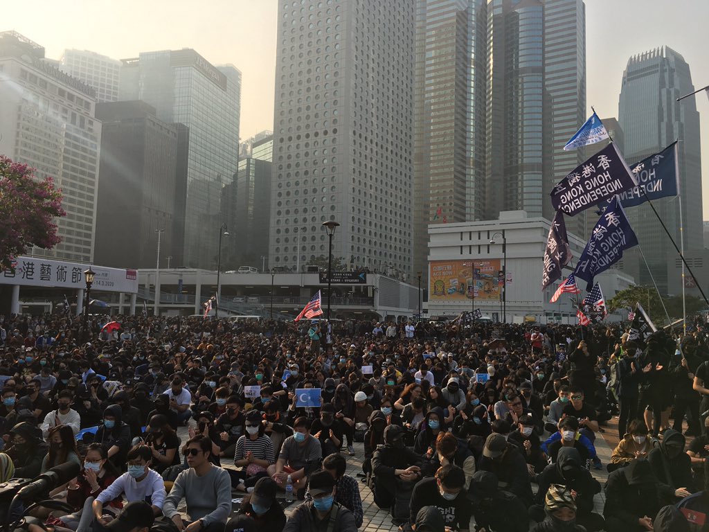 demosisto's tweet photo. #Hongkongers today staged a rally in support of #Uyghurs, but #hkpolice moved in to end the rally with batons and teargas. #Police even pointed guns at #HongKongProtesters. #PoliceBrutality #policestatehk https://t.co/kKftL5W28d