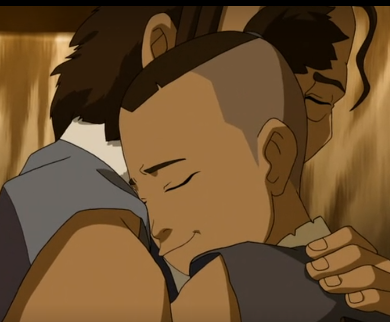 Sokka and his dad hugging. 