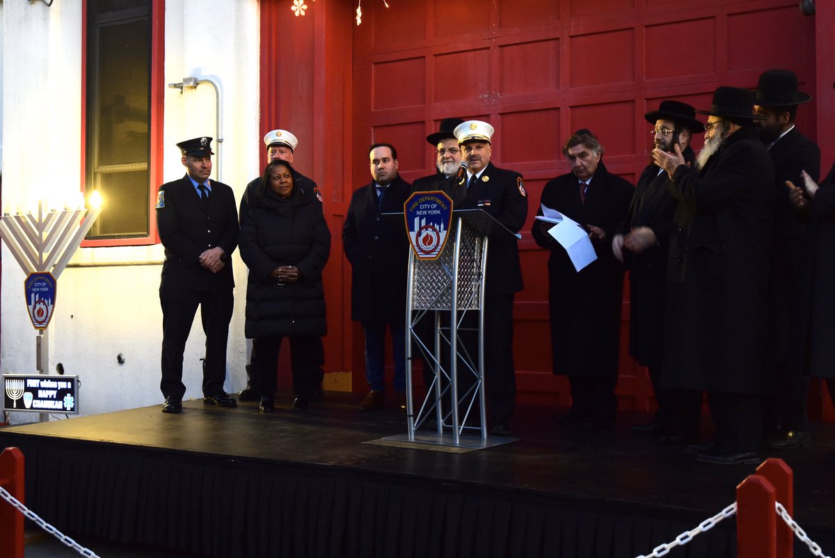 FDNY's tweet photo. FDNY members celebrated the first night of Chanukah with a community menorah lighting ceremony at #Engine211 #Ladder119 in Brooklyn. See #FDNYSmart tips for a safe holiday season at https://t.co/NpwdRdlElY https://t.co/umDbbqEWQk