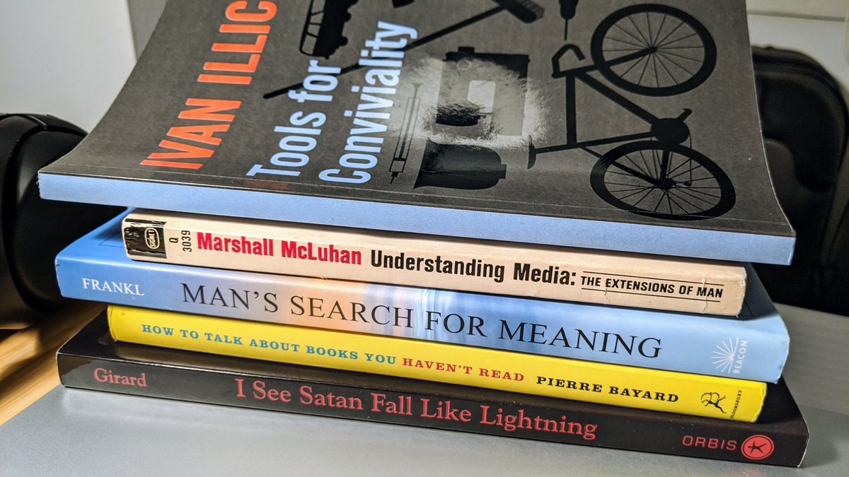 Bunch of stacked books: Tools for Conviviality, Understanding Media, Man's search for meaning, how to talk about books you haven't read, I see Satan fall like lightning