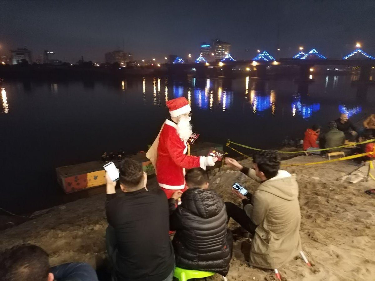 TimesIraq's tweet photo. Santa Claus is celebrating Christmas holiday with Iraqi protesters in Al-Tahrir square in Baghdad.
#IraqProtests https://t.co/sRYhvydZnN