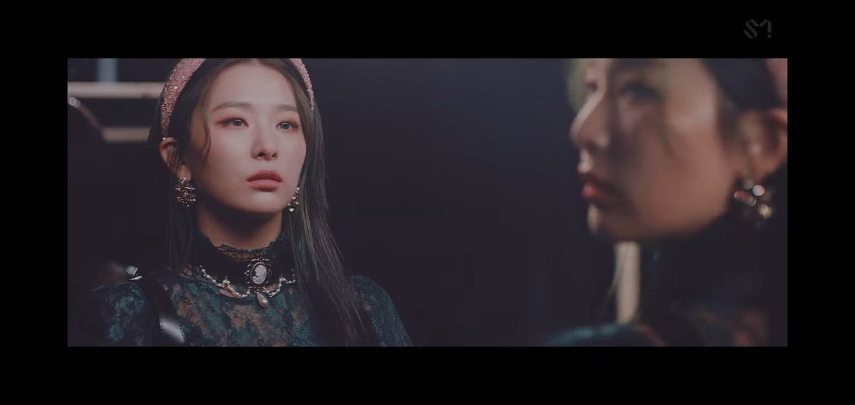 107.1. There is this scene where Seulgi is in front of a mirror. And her reflection is moving opposite to her. Then look at her face in the 2nd photo, she looks like she is gonna cry any moment. My theory is that there are 2 sides of Seulgi's feeling right now.