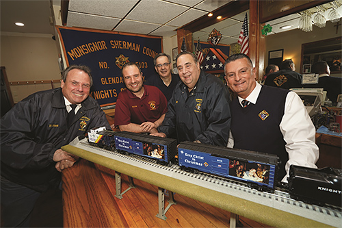 KofC's tweet photo. Day 11 of "12 Knights of Christmas":

Special K of C model boxcars urge families to ‘Keep Christ in Christmas’: https://t.co/MhQd8CrYoN #12KnightsofChristmas https://t.co/gnzHaR3tvq