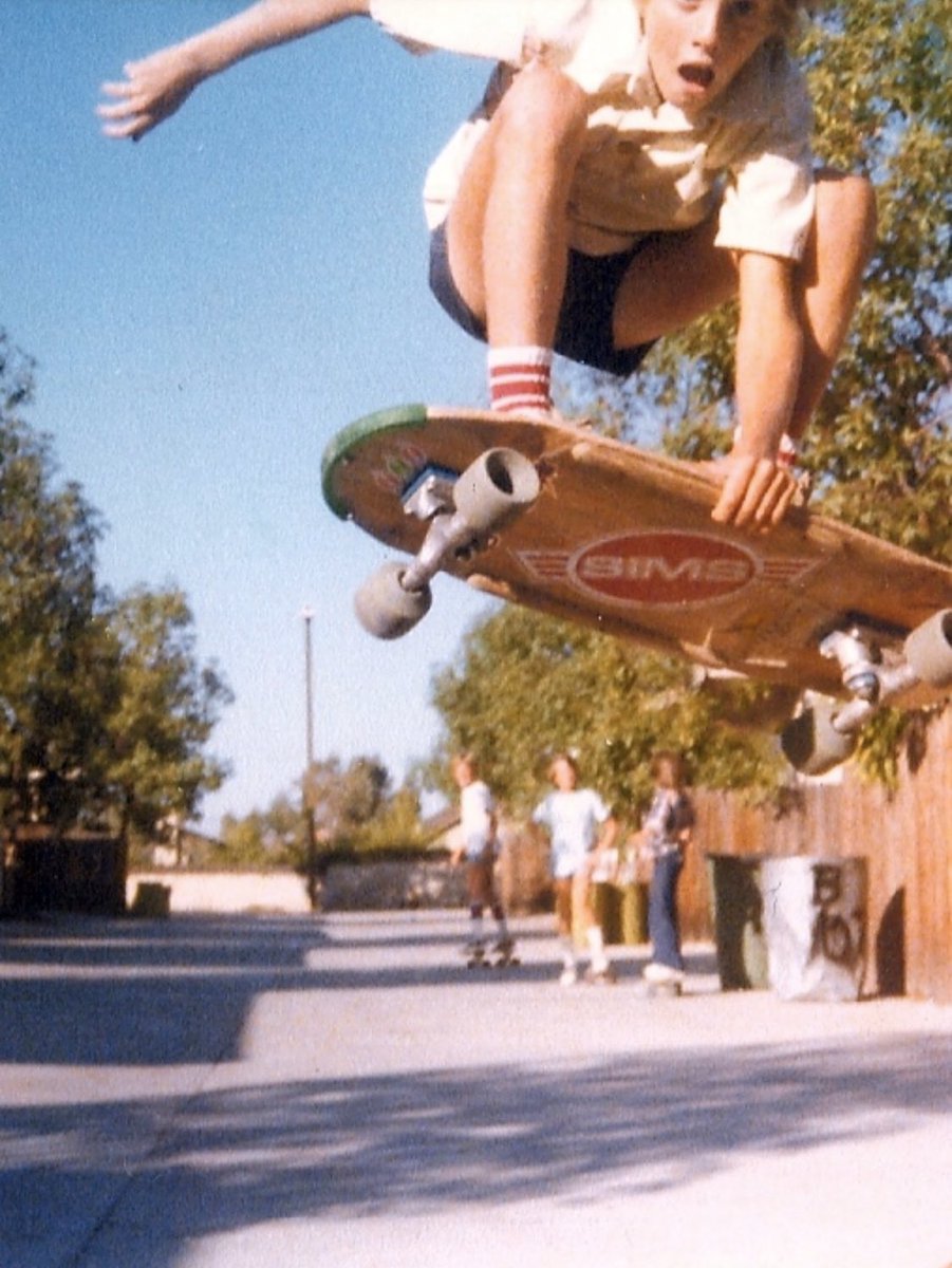 tonyhawk's tweet image. 1978: off the side of our driveway ramp, swap meet board (that I said was an “Andrecht prototype” because I was embarrassed), wooden rails my dad made, Gullwings, Sims Snakes, nose guard and Sims stickers I bought with paper-route money. Stinkbug grab was purely for survival btw