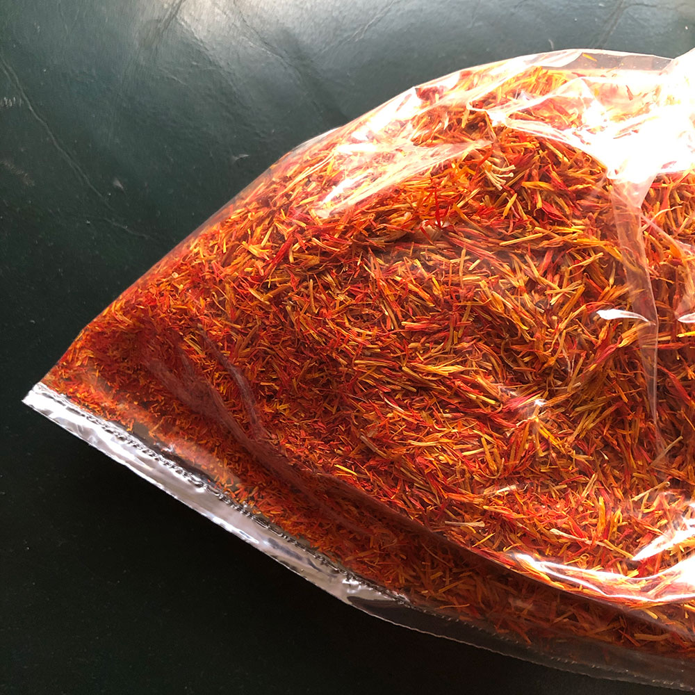 showing off of wealth was involved.) Here is safflower I bought today, & the dye it started releasing after a few seconds of steeping. It was labelled "saffron" in Arabic and English, & the buyer is expected to know from the price which is which. Old texts would be no different.
