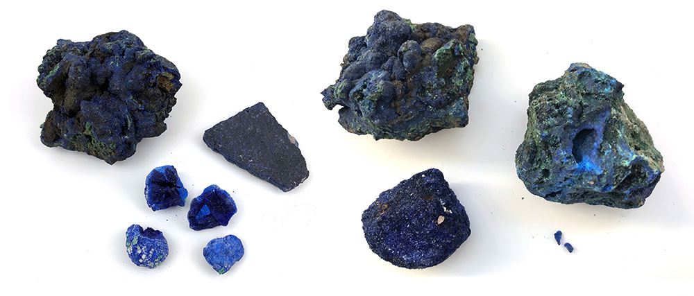 with the peculiarity that time (and water molecules in the air) slowly turns it to malachite, which is as green as anything. The older the azurite, the more obvious the green tint. Lapis suffers no such discolouration. Here are azurite samples: greenishness is evident.