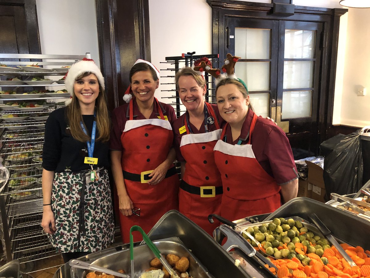 Senior nursing staff serving Christmas dinner
